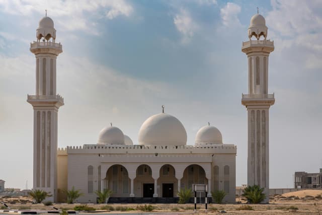 Beautiful mosque exterior in Umm Al Quwain, UAE, showcasing Islamic architecture.