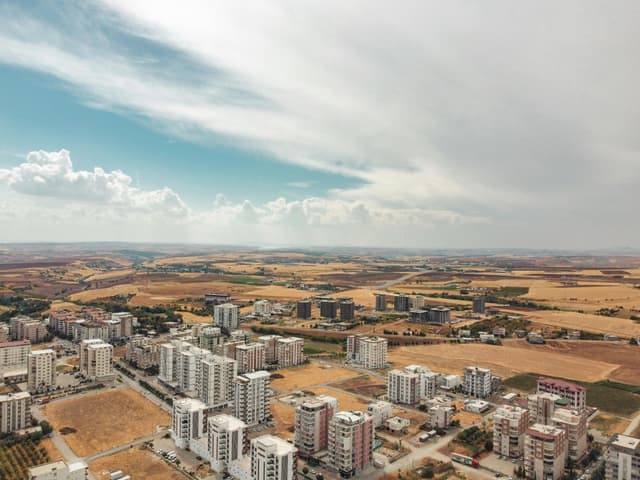 Aerial perspective of Adıyaman, Türkiye, showcasing the urban and rural landscape contrast.