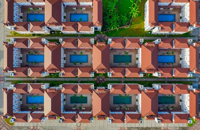 Aerial view of a housing complex with pools in Tangerang, Banten, Indonesia.