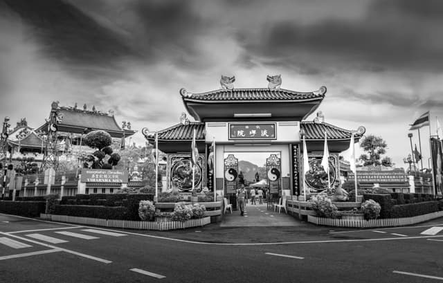 A striking black and white image of Viharnra Sien Museum entrance in Pattaya City, Thailand.