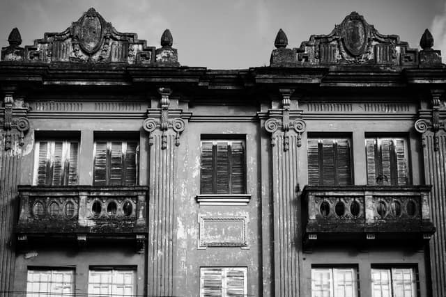 Black and white photograph of an old building facade in Santa Maria, Brazil.