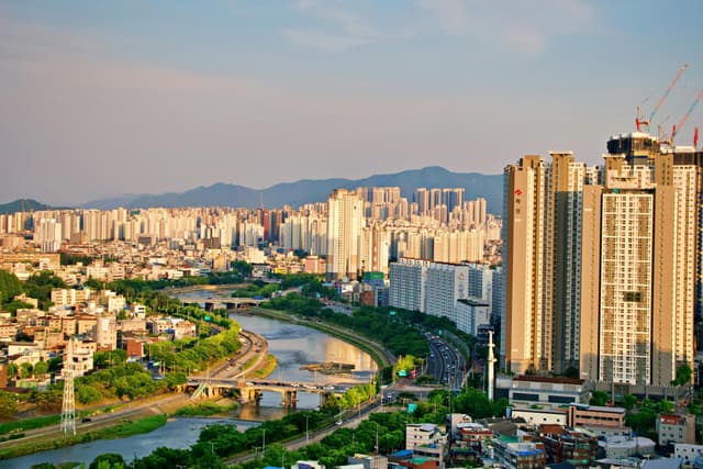 Explore the vibrant skyline of Daegu as seen from above, highlighting its modern architecture.