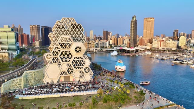 Aerial view of Kaohsiung Harbor showcasing modern architecture and vibrant cityscape.