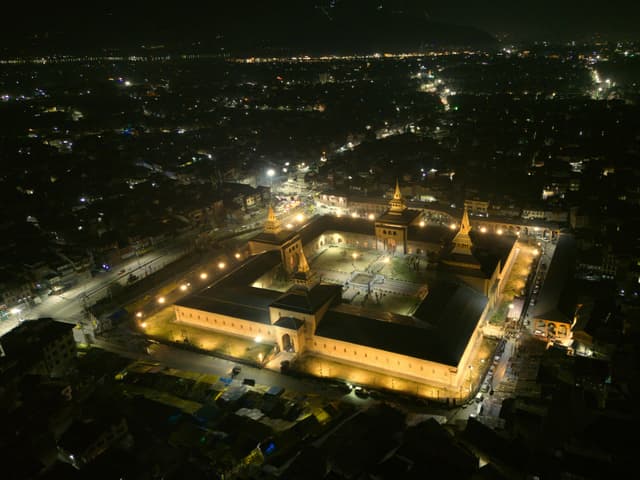 Stunning aerial night view of the illuminated Jamia Masjid in Srinagar, Kashmir.
