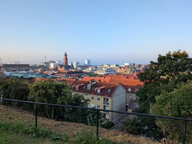 A picturesque view of Helsingborg's rooftops and skyline under a clear blue sky.