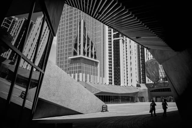 Dramatic black and white view of Taipei's modern architecture.