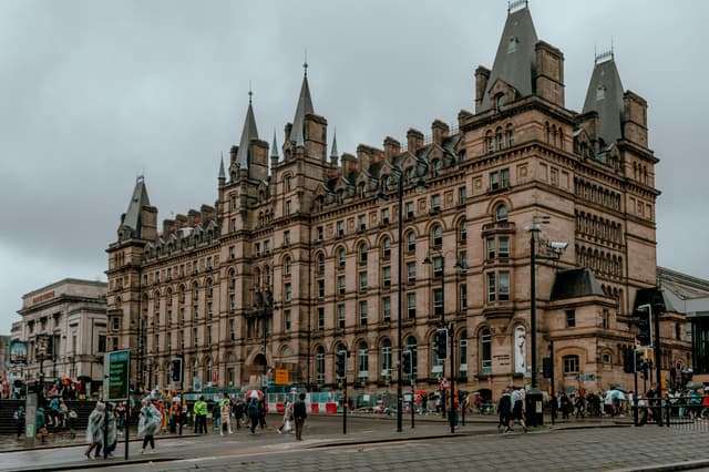 Stunning Victorian architecture in Liverpool city center, bustling with pedestrians.