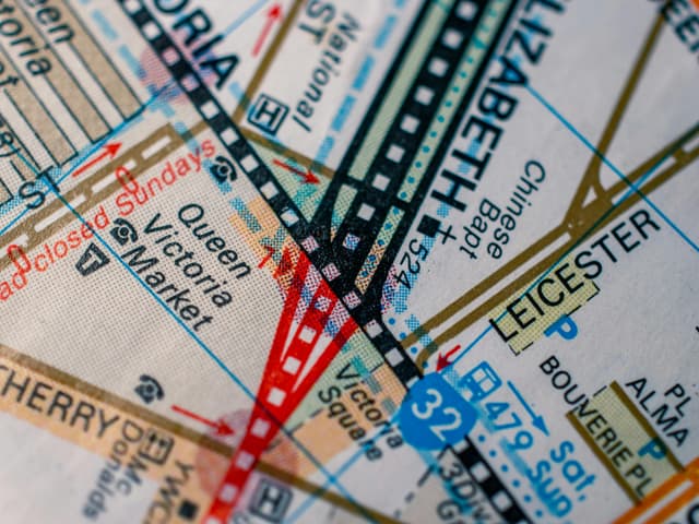 Detailed close-up of Melbourne map highlighting Queen Victoria Market and other landmarks in vivid colors.