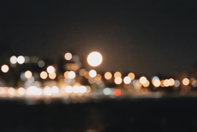 Out-of-focus city lights create a magical nighttime scene in St Kilda, Melbourne.