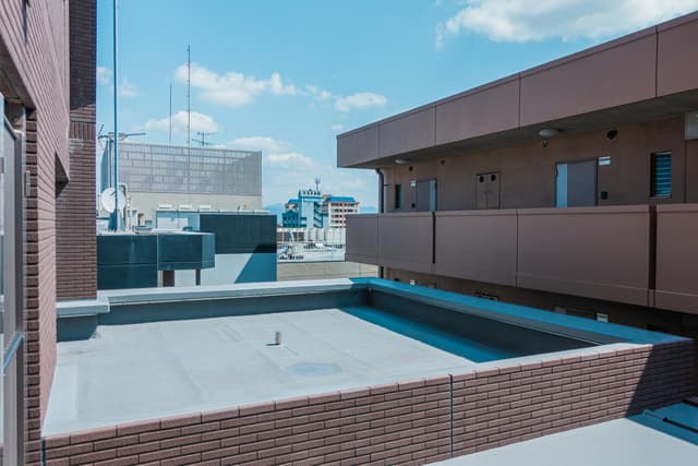 Explore modern architecture from a rooftop perspective in Fukuoka, Japan.