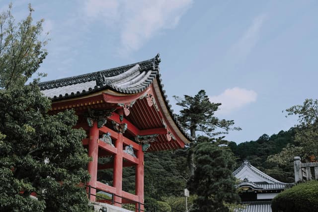Scenic view of a traditional pagoda surrounded by trees in Kyoto, Japan.