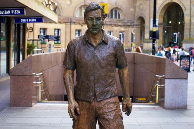 Bronze statue depicting a man at Newcastle's local landmark in England.