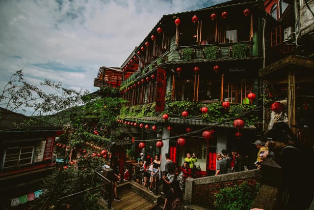Explore Jiufen's vibrant streets with iconic red lanterns in New Taipei City, Taiwan.